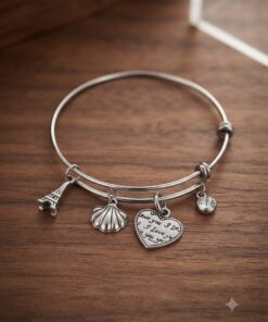 Bracciale acciaio rigido con ciondoli torre conchiglia cuore zircone cubico
