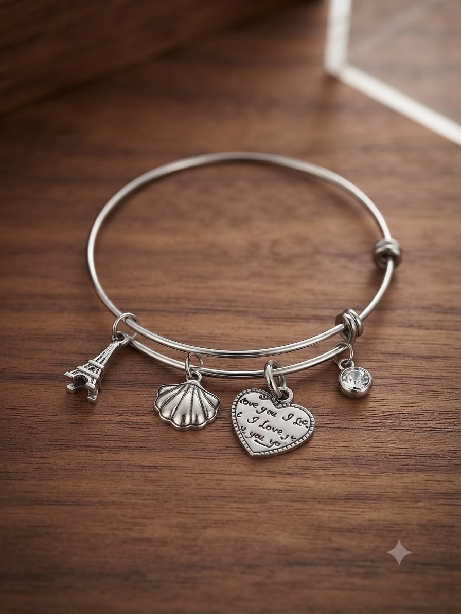Bracciale acciaio rigido con ciondoli torre conchiglia cuore zircone cubico